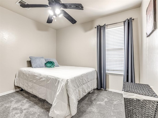 bedroom with ceiling fan, carpet floors, visible vents, and baseboards