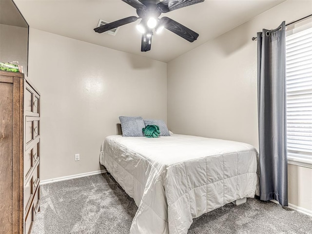 bedroom with ceiling fan, carpet, and baseboards