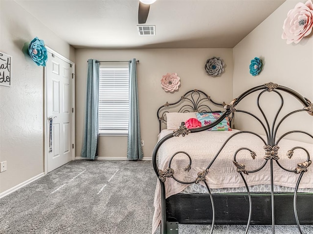 bedroom with a ceiling fan, baseboards, visible vents, and carpet flooring