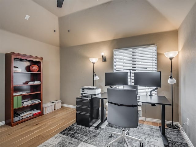 office featuring wood finished floors, baseboards, and ceiling fan