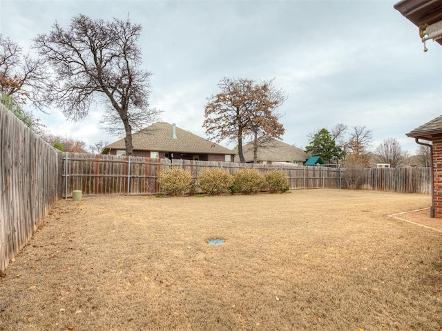 view of yard featuring a fenced backyard