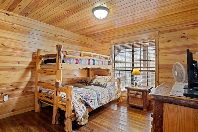 bedroom featuring wooden walls, wood ceiling, and wood-type flooring