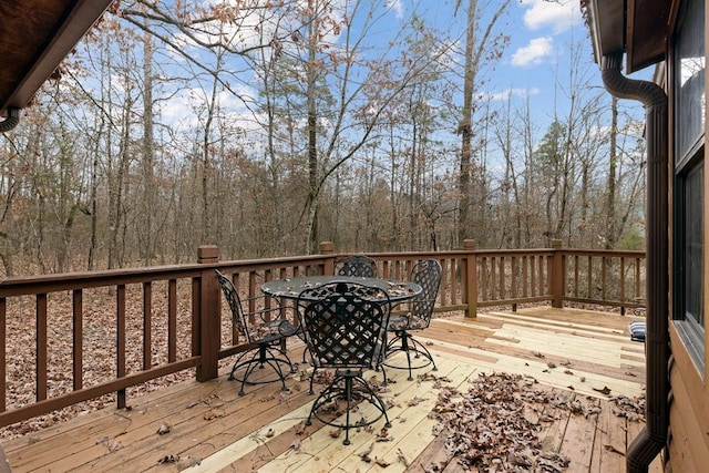 wooden deck with outdoor dining space