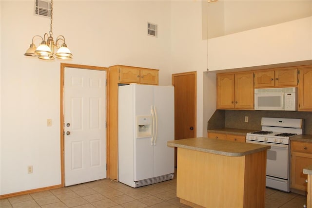 kitchen with white appliances, visible vents, and light tile patterned flooring