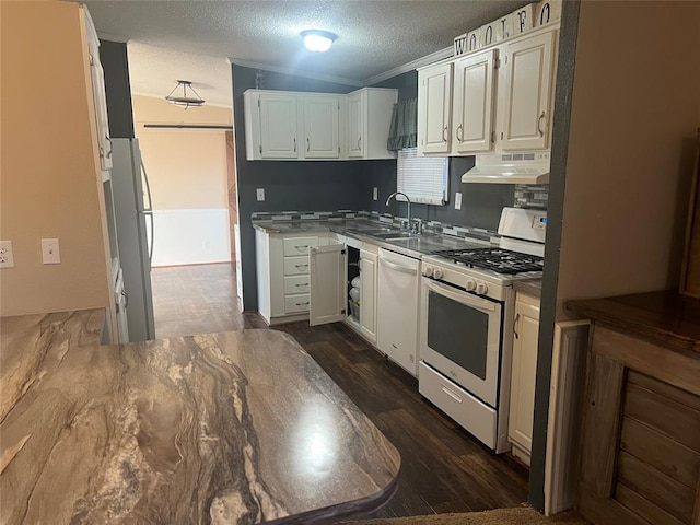 kitchen featuring under cabinet range hood, white appliances, a sink, white cabinetry, and dark wood-style floors