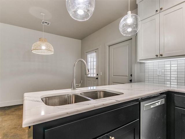 kitchen featuring visible vents, stainless steel dishwasher, decorative backsplash, light stone countertops, and pendant lighting