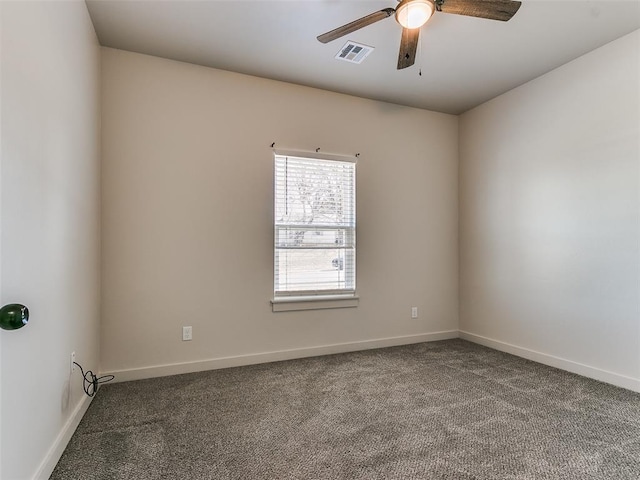 unfurnished room featuring a ceiling fan, carpet flooring, visible vents, and baseboards