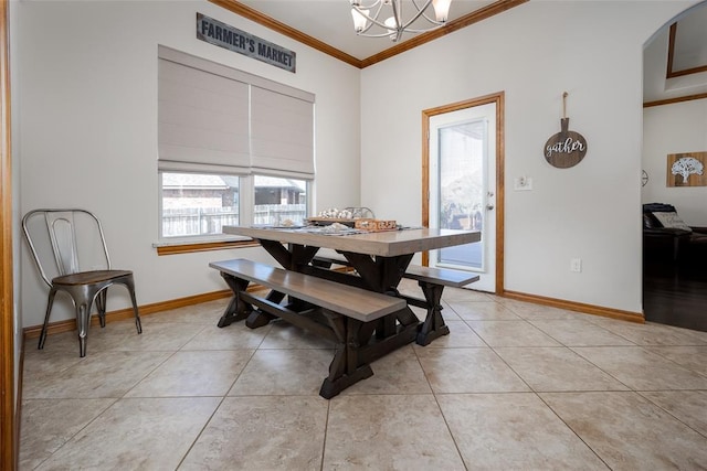 dining area featuring baseboards, a chandelier, crown molding, and light tile patterned flooring