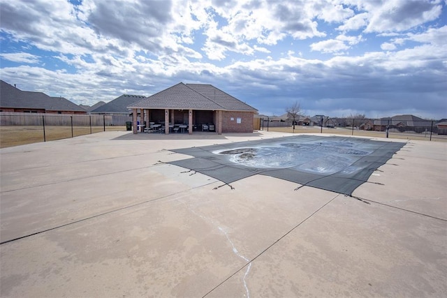 pool featuring fence, a gazebo, and a patio