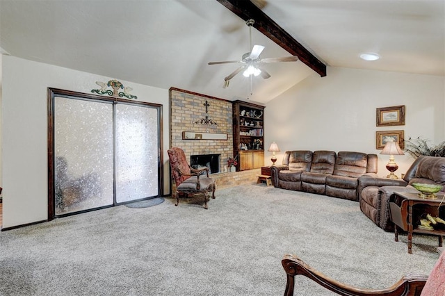 living room with ceiling fan, a brick fireplace, lofted ceiling with beams, and carpet