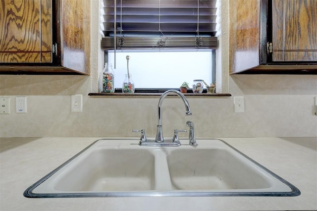 kitchen with light countertops and a sink