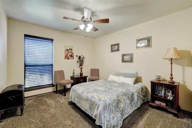 bedroom featuring a ceiling fan and carpet