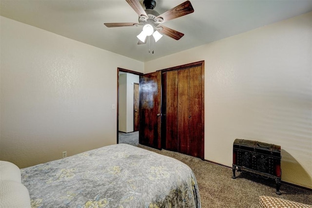 carpeted bedroom featuring a closet and ceiling fan