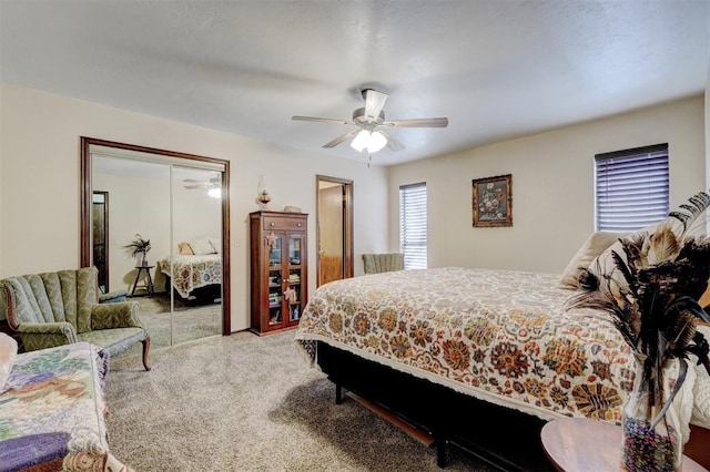 bedroom with a closet, carpet flooring, and ceiling fan