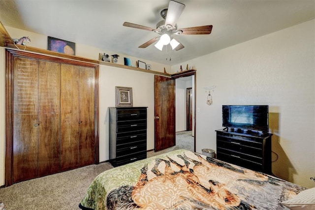 carpeted bedroom with a closet and ceiling fan