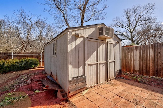 view of shed featuring a fenced backyard