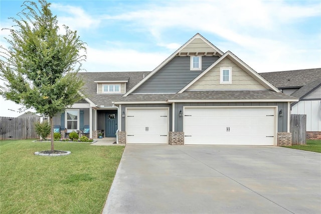 craftsman-style house featuring concrete driveway, brick siding, a front yard, and fence