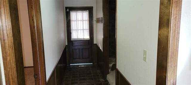 entryway featuring dark tile patterned flooring