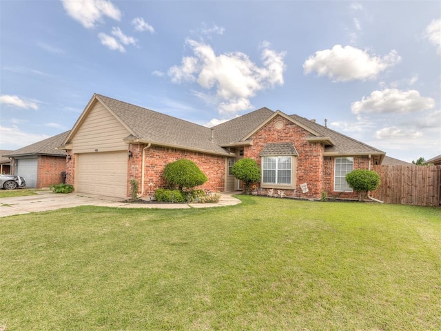 ranch-style home featuring brick siding, concrete driveway, an attached garage, fence, and a front lawn