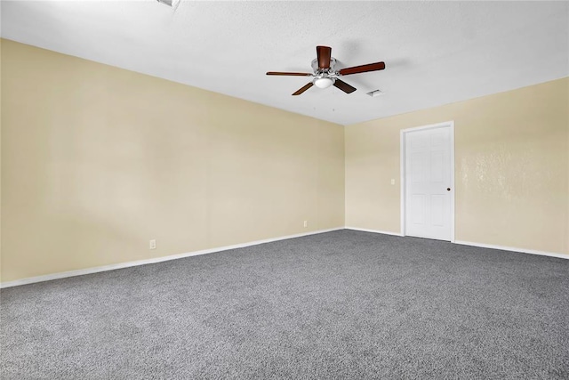 spare room featuring ceiling fan, carpet floors, a textured ceiling, and baseboards