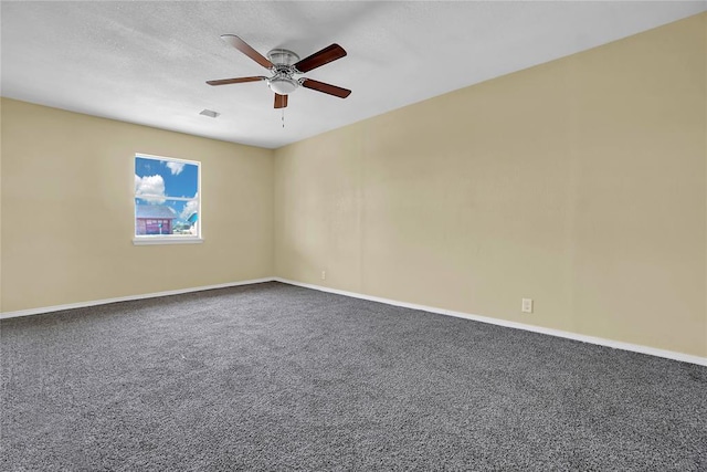 unfurnished room with ceiling fan, carpet flooring, and baseboards