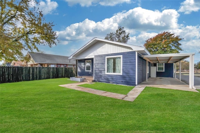 exterior space featuring a front lawn and fence