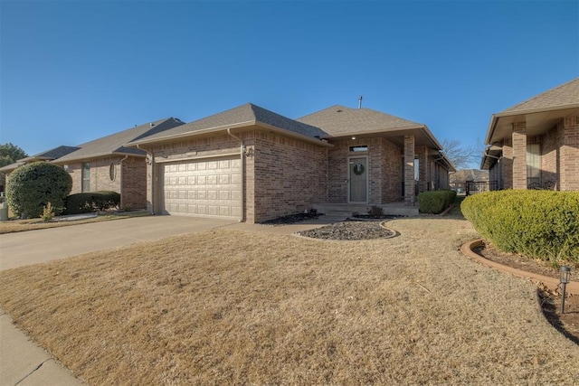 single story home featuring concrete driveway, an attached garage, brick siding, and a shingled roof