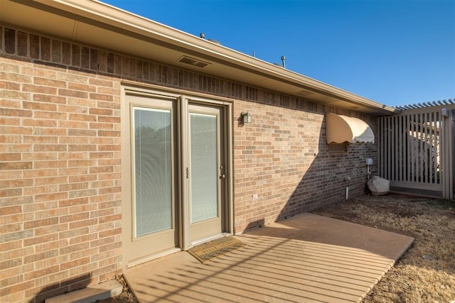 exterior space with brick siding