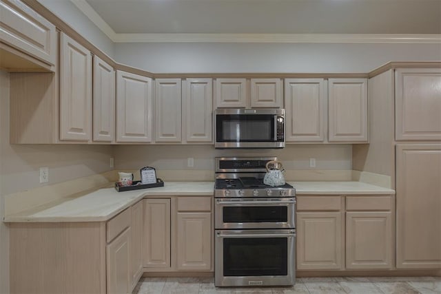 kitchen featuring appliances with stainless steel finishes, ornamental molding, light brown cabinetry, and light countertops