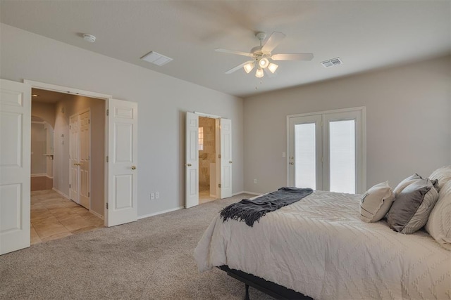 bedroom with visible vents, carpet, arched walkways, and baseboards