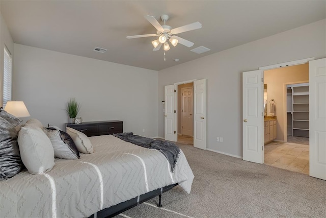 bedroom with a ceiling fan, light colored carpet, visible vents, and baseboards