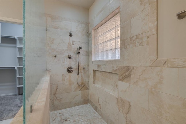 full bathroom with a tile shower