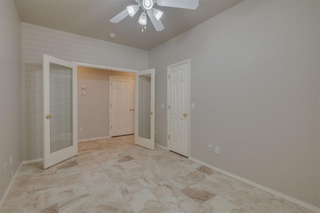 unfurnished bedroom featuring french doors, a ceiling fan, and baseboards