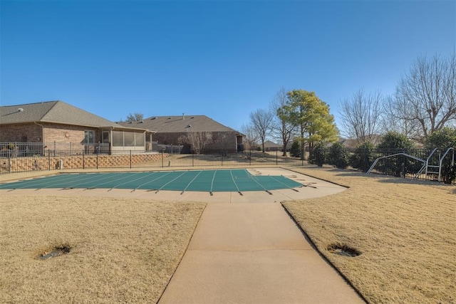 pool featuring a patio area and fence