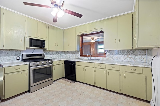 kitchen featuring cream cabinets, light floors, a sink, light countertops, and black appliances