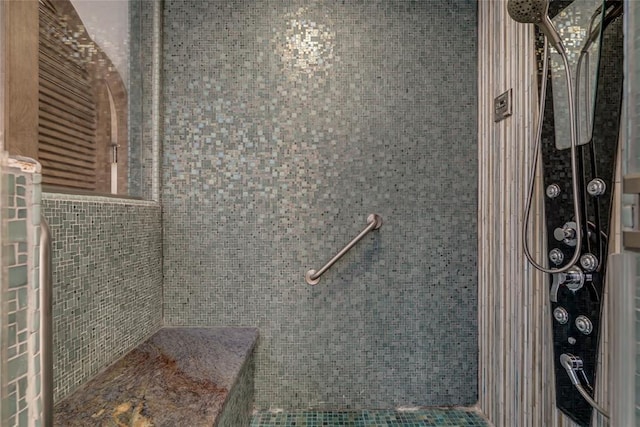 bathroom with tiled shower