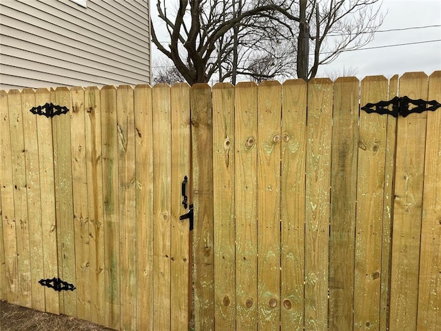 exterior details featuring a gate and fence