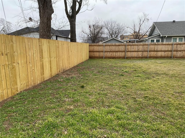 view of yard featuring a fenced backyard