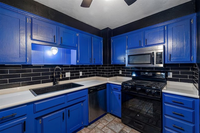 kitchen with stainless steel appliances, light countertops, a sink, and decorative backsplash