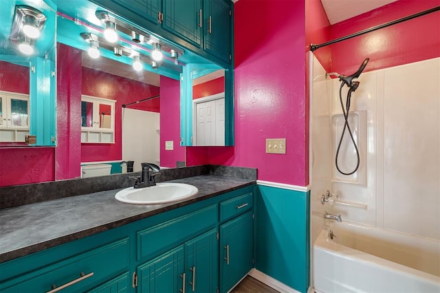 bathroom with bathtub / shower combination and vanity