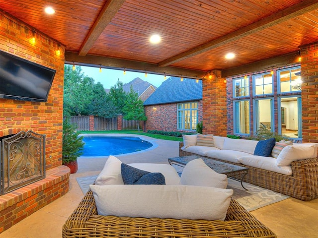 view of pool with a patio, an outdoor living space with a fireplace, a fenced backyard, and a fenced in pool