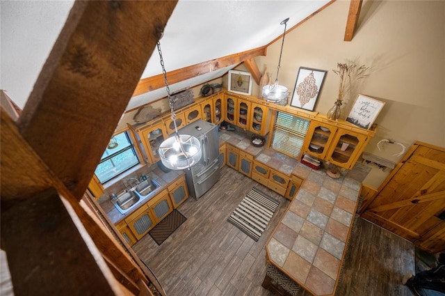 living room featuring an inviting chandelier, wood finished floors, and beamed ceiling