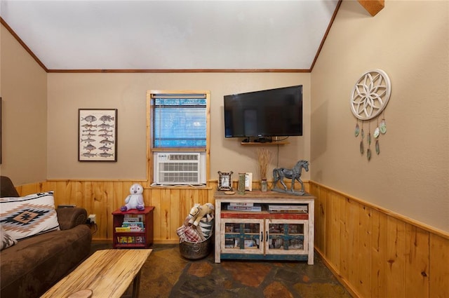 living room with lofted ceiling, a wainscoted wall, cooling unit, crown molding, and wood walls