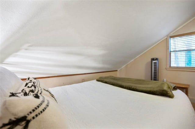 bedroom featuring lofted ceiling