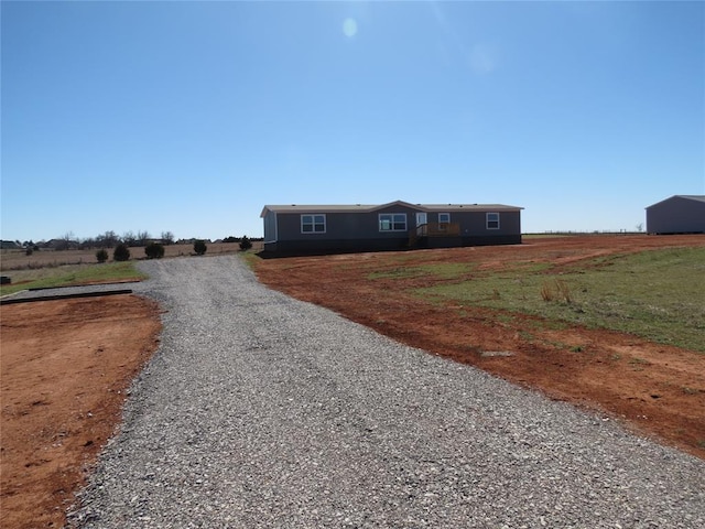 view of front of house with a rural view