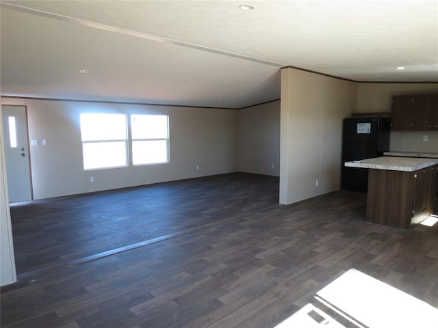 unfurnished living room with dark wood-style floors