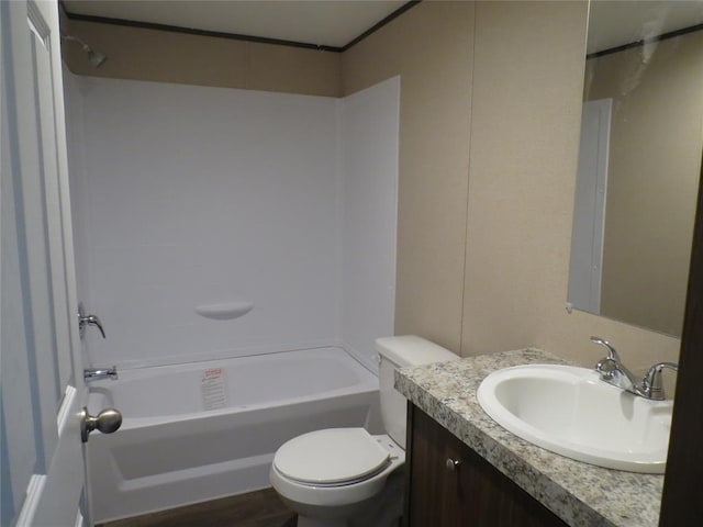 full bathroom featuring shower / tub combination, vanity, and toilet