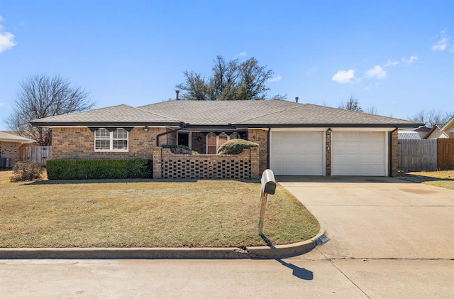 ranch-style house featuring a garage, central AC, brick siding, fence, and driveway