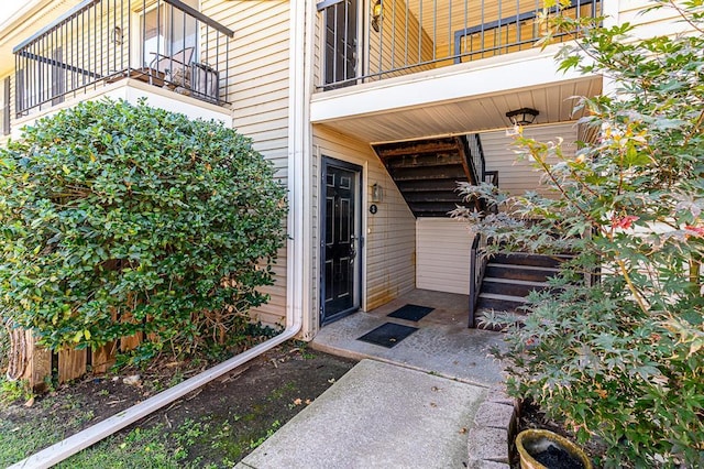 entrance to property with a balcony