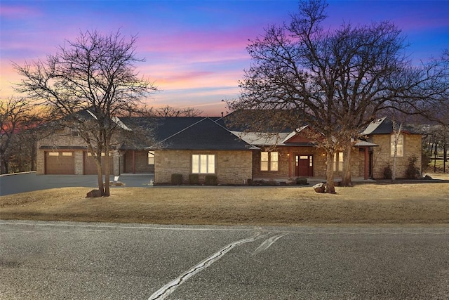 view of front facade with driveway and an attached garage